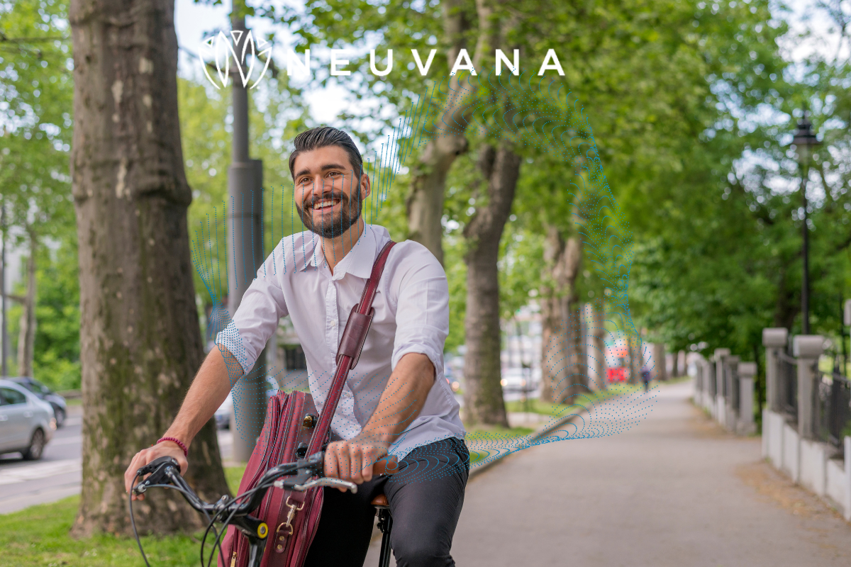 A man riding a bike smiling