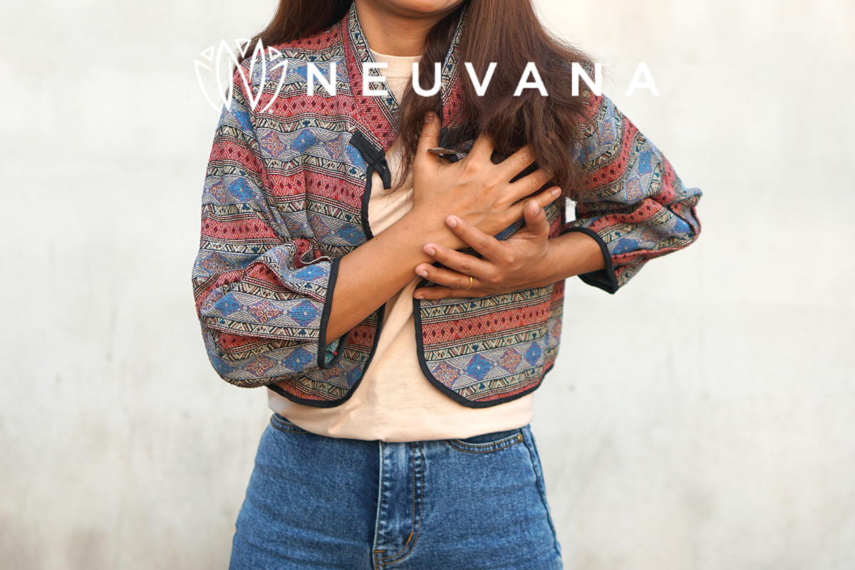 Woman with her hands placed over her heart