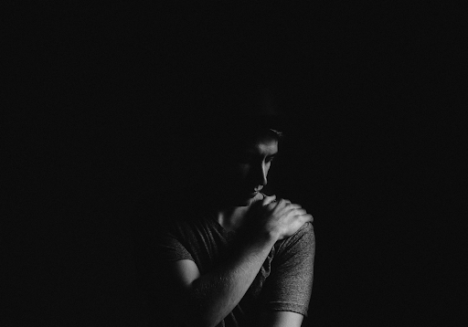 man looking stoic and solemn in black and white