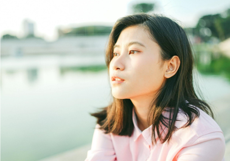 woman looking off into the water