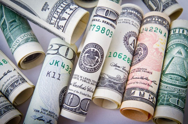 United States Dollar Bills in varying denominations and colors