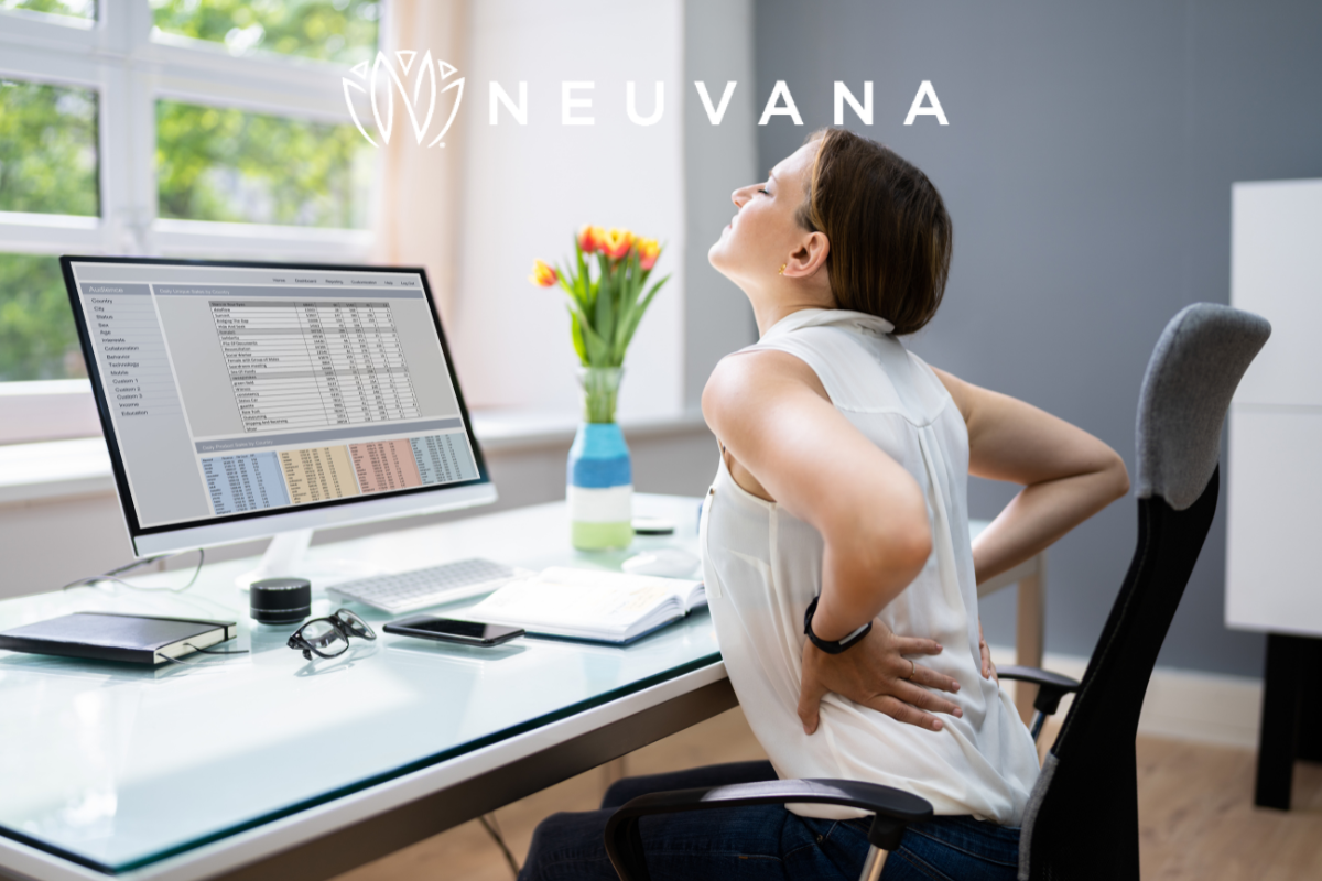 Woman sitting in chair with back pain