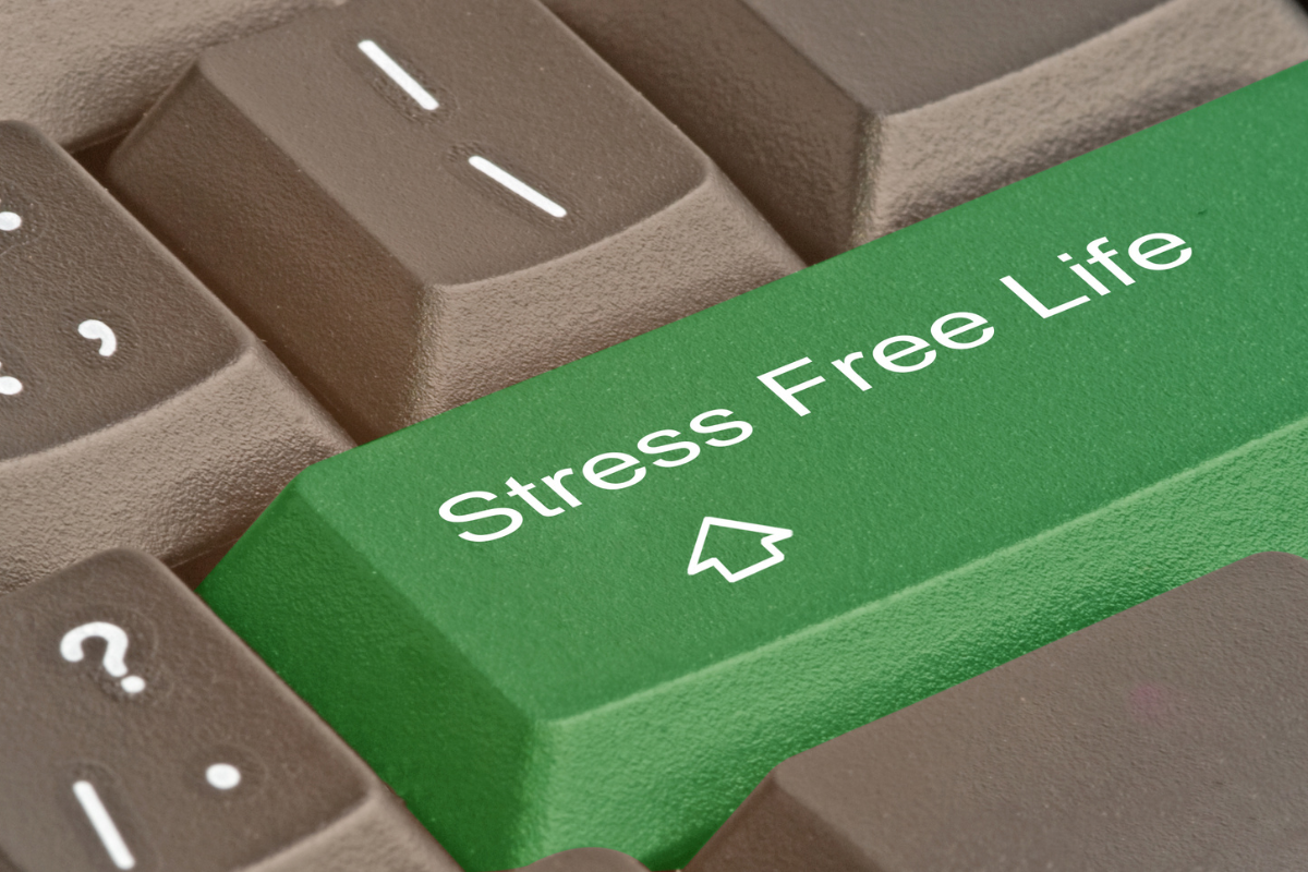 image of a grey keyboard with one green key that says "stress free life" with an upward arrow